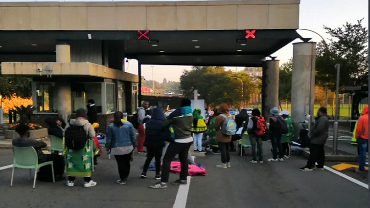 The students are protesting over accommodation at the university.