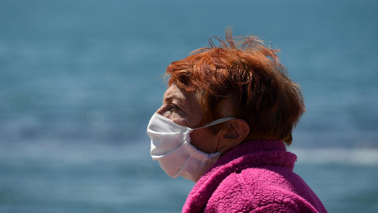 A woman wears a face mask at the touristic port in Ostia near Rome, as the spread of the coronavirus disease (COVID-19) continues in Italy.