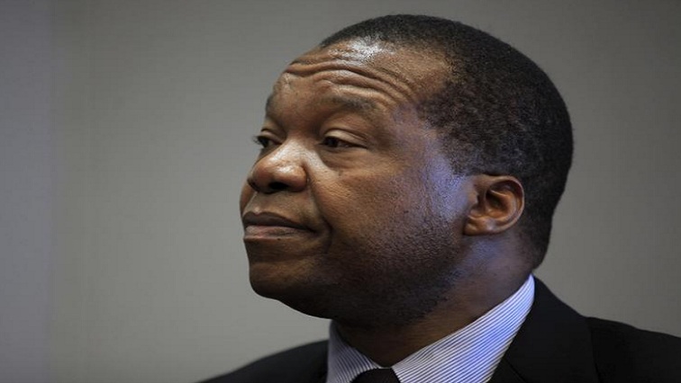 Reserve Bank of Zimbabwe Governor John Mangudya listens to questions during an interview in Harare, File.