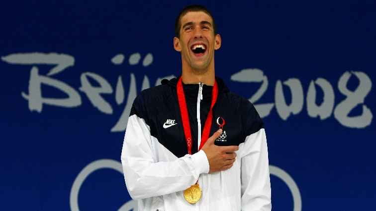 FILE PHOTO: Michael Phelps of the U.S. smiles during the medal presentation ceremony after winning the men's 400m individual medley swimming final at the National Aquatics Center during the Beijing 2008 Olympic Games August 10, 2008.     REUTERS/David Gray (CHINA)/File Photo
