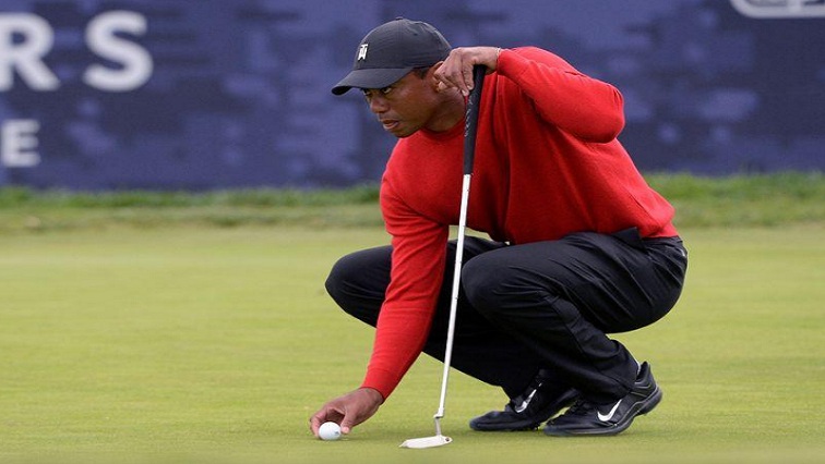 Tiger Woods lines up a putt on the 13th green during the final round of the Farmers Insurance Open golf tournament at Torrey Pines Municipal Golf Course - South Co.