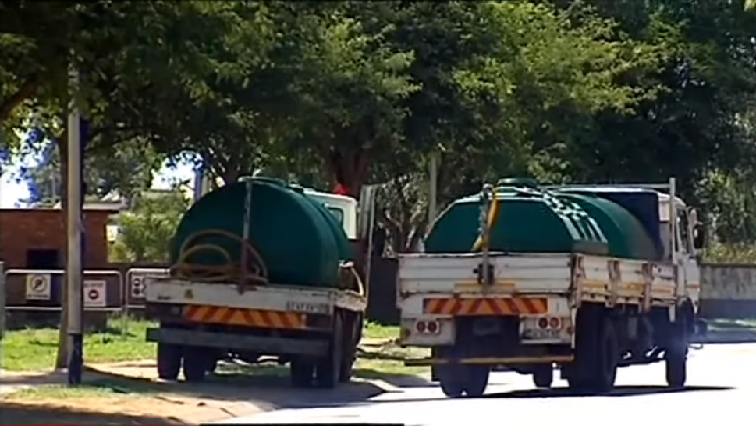 Trucks seen delivering water during an outage