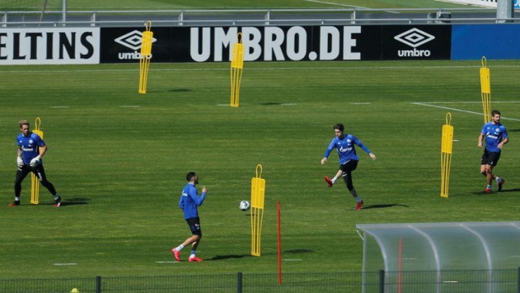 Schalke 04 players try to keep a safe distance during their training session, as the spread of the coronavirus disease (COVID-19) continues.