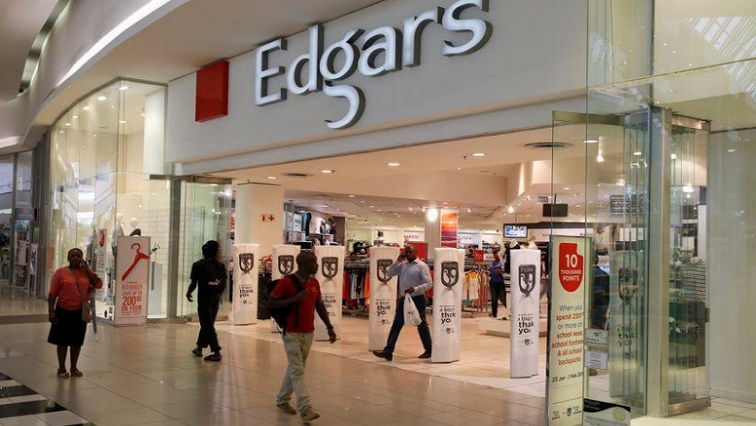 File Image: Shoppers walk past an Edgars store at a shopping centre in Soweto, southwest of Johannesburg.
