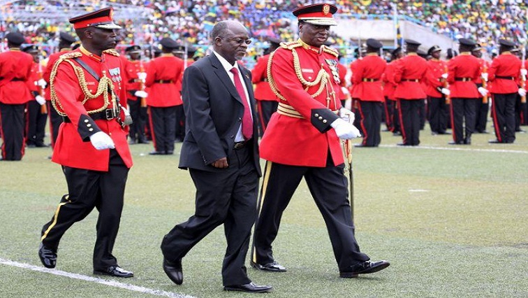 Tanzania's President John Magufuli is escorted after inspecting a Tanzanian military guard of honour during his inauguration ceremony at the Uhuru Stadium in Dar es Salaam, on November 5, 2015.