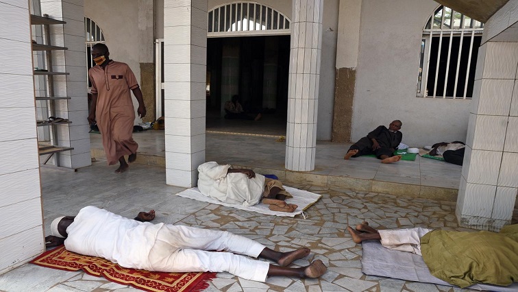 People sleeping outside Mosque