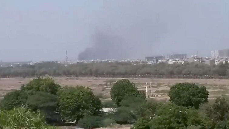 A plume of smoke is seen after the crash of a PIA aircraft in Karachi, Pakistan May 22, 2020.