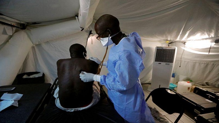 A Senegalese army doctor examines a local resident at the army field hospital, amid the outbreak of the coronavirus disease (COVID-19) in Touba, Senegal May 1, 2020.