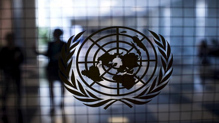 The video shows a woman in a red dress straddling a man in the back seat of a 4X4 with UN marking with individuals thought to be assigned to the UN Truce Supervisions Organisation sitting in the front seat.