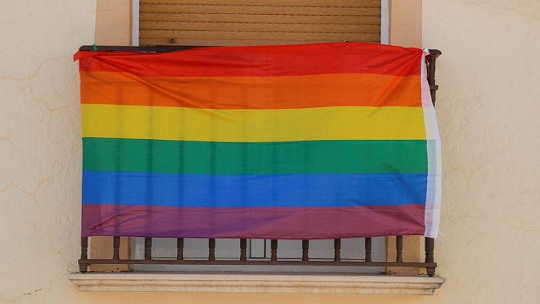 A rainbow flag hangs from the window of a house in a file photo.