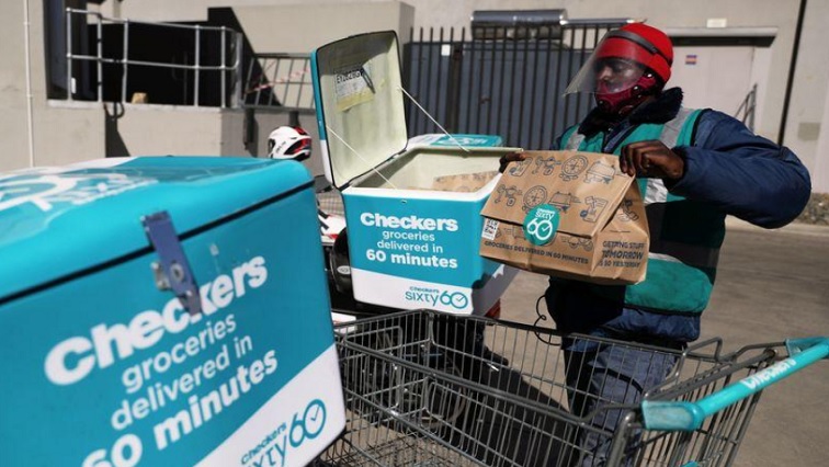 Albert Siwela, a delivery worker, loads online orders from a Checkers store, amid a nationwide coronavirus lockdown, in Johannesburg, South Africa, July 14, 2020.