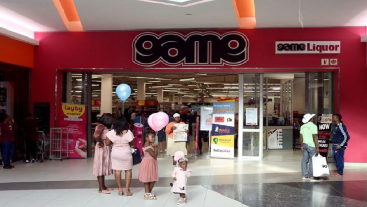Shoppers stand outside the outlet for Massmart-owned Game Store in Polokwane, Limpopo province, South Africa, June 1,2019.