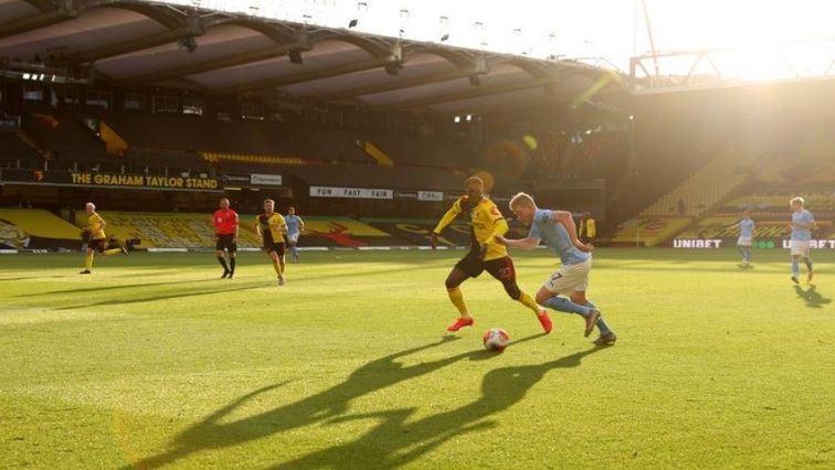 Manchester City's Kevin De Bruyne in action with Watford's Ismaila Sarr, as play resumes behind closed doors following the outbreak of the coronavirus disease (COVID-19).