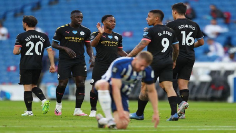 Manchester City's Raheem Sterling celebrates scoring their first goal with teammates, as play resumes behind closed doors following the outbreak of the coronavirus disease (COVID-19)