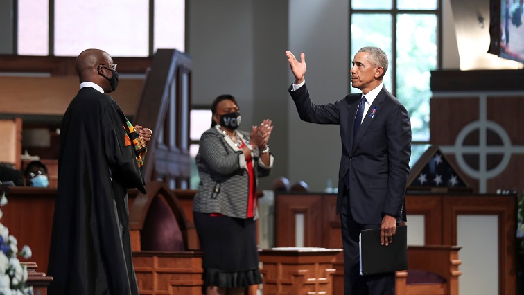 Former US President Barack Obama addresses the service in front of Reverend Raphael Warnock during the funeral of late US Congressman John Lewis.