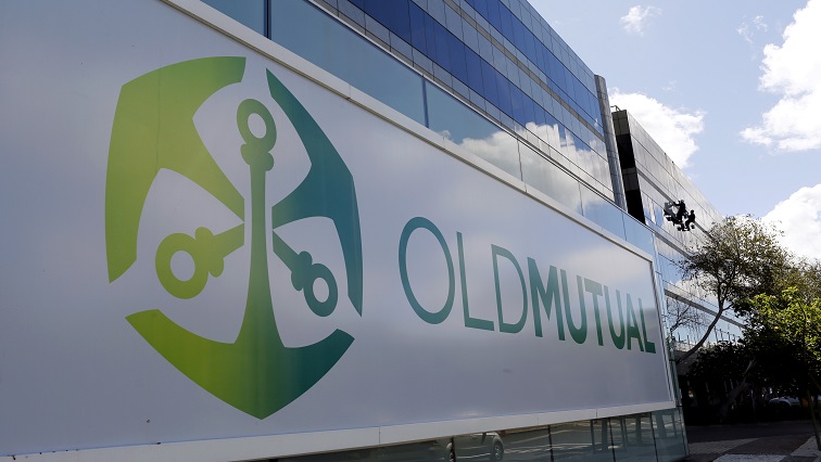 FILE PHOTO: Workers clean windows outside the Cape Town headquarters of Anglo-South African financial services company Old Mutual.