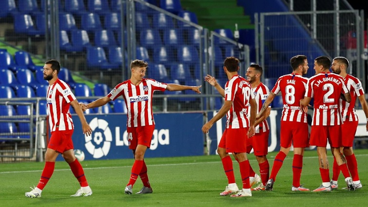 Atletico Madrid's Marcos Llorente celebrates scoring their first goal with teammates, as play resumes behind closed doors following the outbreak of the coronavirus disease (COVID-19).