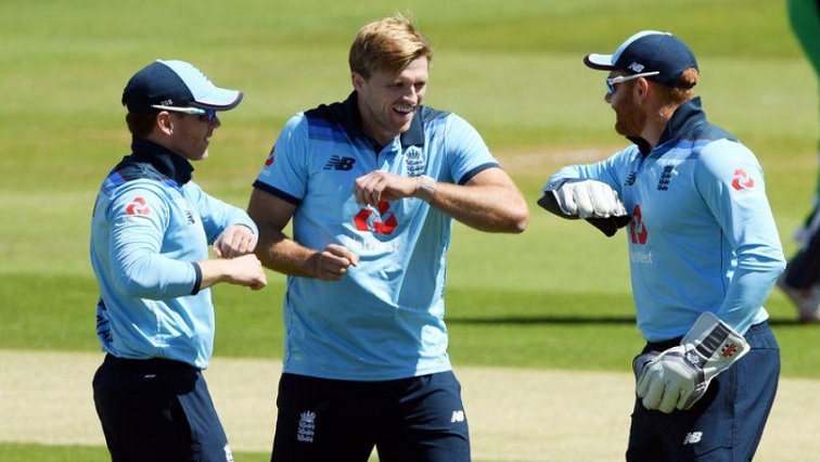 England's David Willey celebrates with Eoin Morgan and Jonny Bairstow after taking the wicket of Ireland's Paul Stirling, as play resumes behind closed doors following the outbreak of the coronavirus disease (COVID-19).