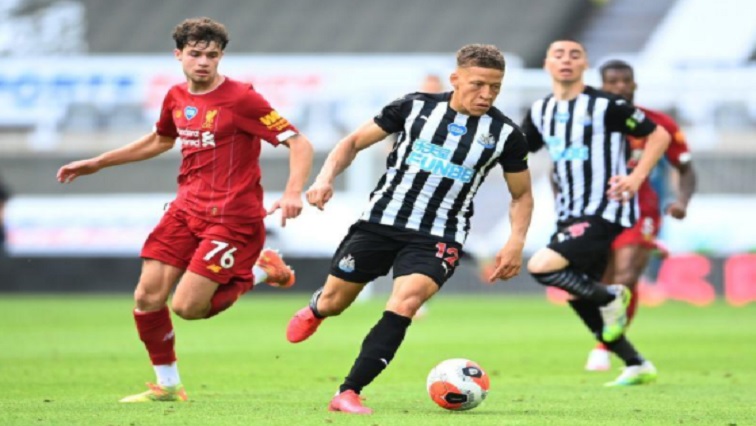 Newcastle United's Dwight Gayle in action with Liverpool's Neco Williams, as play resumes behind closed doors following the outbreak of the coronavirus disease (COVID-19)
