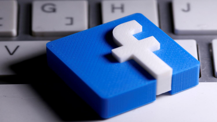 A 3D-printed Facebook logo is seen placed on a keyboard in this illustration taken.