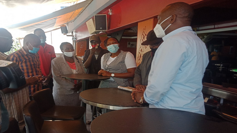 Bar staff report for duty in Nairobi, Kenya.