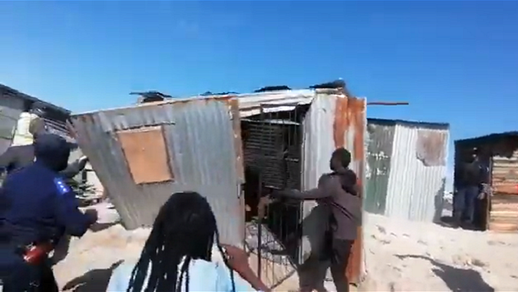 A video went viral on social media of Bulelani Qhalani, being manhandled outside his shack.