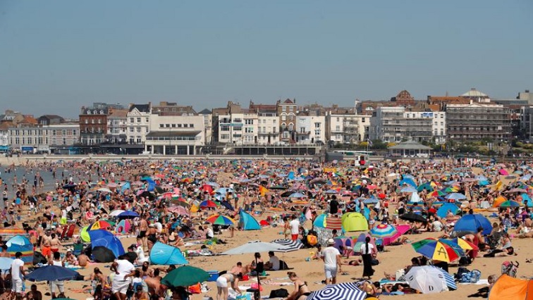People enjoy the hot weather on Margate beach in Margate, Britain, June 24, 2020.