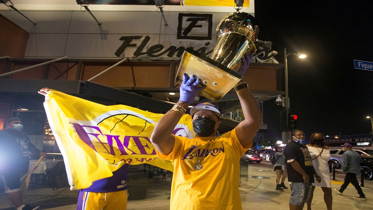 Los Angeles Lakers fans celebrate their team winning the 2020 NBA Championship against the Miami Heat, during the outbreak of Coronavirus disease (COVID-19) in Los Angeles.