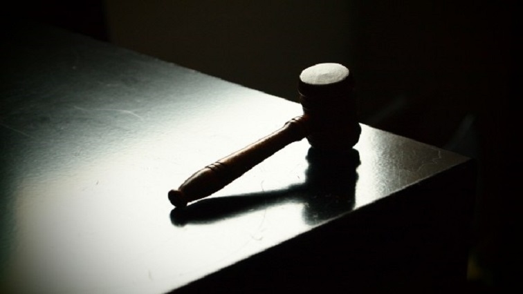 Court gavel seen on a judge's desk.