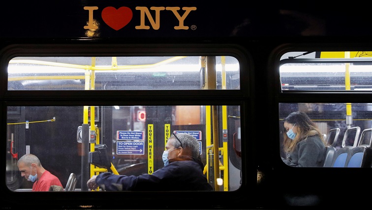 Passengers wearing face masks during the spread of the coronavirus disease (COVID-19), ride a bus along 1st Avenue in Manhattan, New York City.