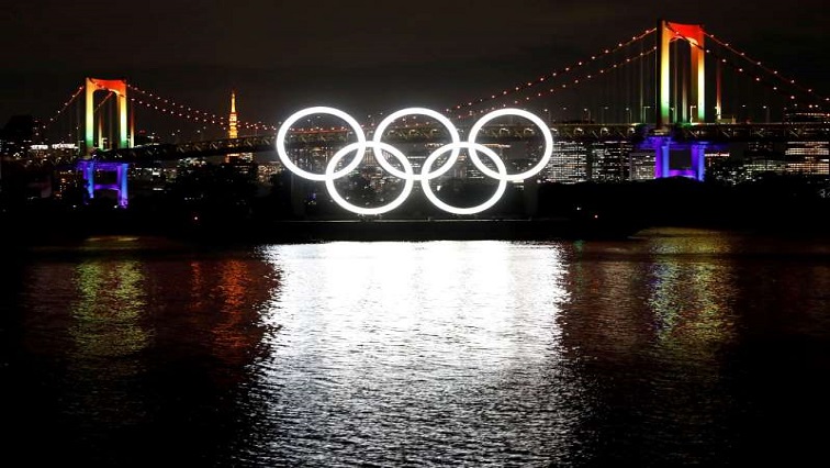The giant Olympic rings are illuminated after being reinstalled at Odaiba Marine Park, amid the coronavirus disease (COVID 19) outbreak, in Tokyo.