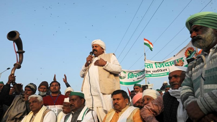 Bharatiya Kisan Union national president, Naresh Tikait, addresses the crowd as farmers take part in a protest against farm bills passed by India's parliament at Delhi-Uttar Pradesh border on the outskirts of Delhi, India, December 17, 2020.