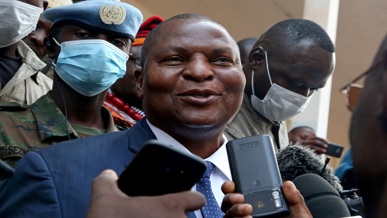 Central African Republic President Faustin Archange Touadera addresses the media outside a polling station, after casting his ballots during the Presidential and legislative elections at a polling station in Lycee Boganda.