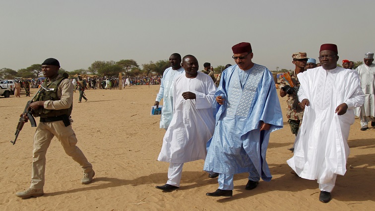 [File image] Niger's former  Interior Minister Mohamed Bazoum (2nd from R) walks with members of his delegation at the Boudouri site for displaced persons outside the town of Diffa.