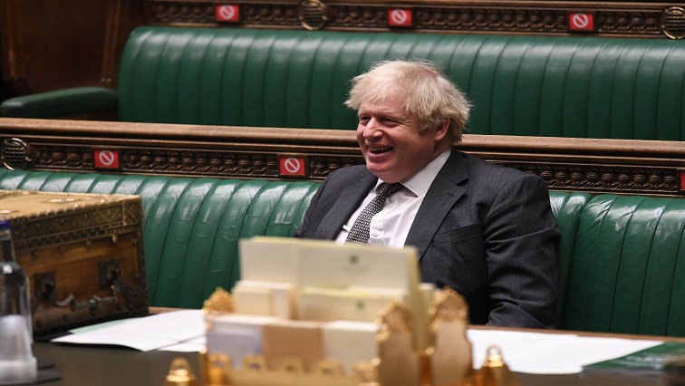 Britain's Prime Minister Boris Johnson reacts during a debate at the House of Commons in Lodon, Britain.