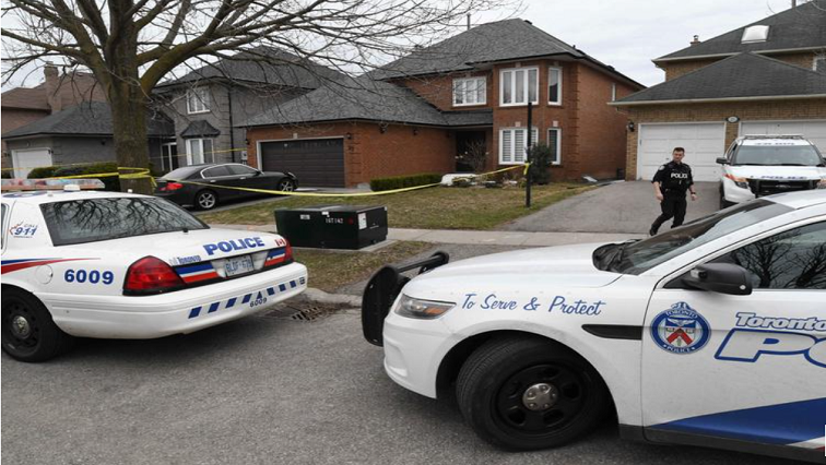 Police vehicles are parked in front of the home of Alek Minassian, a day after multiple people were struck along a major intersection northern Toronto, Ontario.