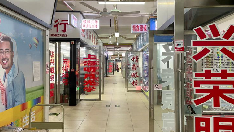 Optical shops are seen open which were originally at the second floor of the Huanan seafood market, where the coronavirus believed to have first surfaced, almost a year after the start of the coronavirus disease (COVID-19) outbreak, in Wuhan, Hubei province, China