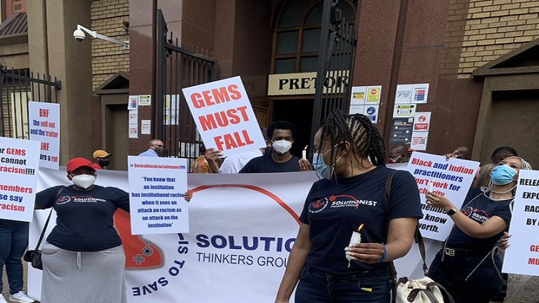 Protestors against the Government Employee Medical Aid Scheme are seen outside the High Court in Pretoria.