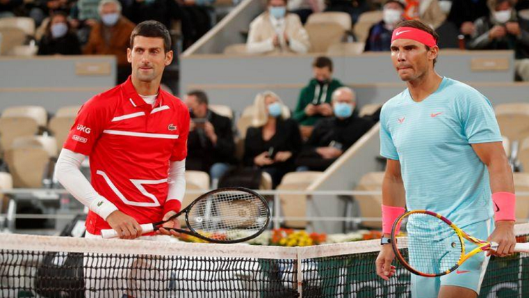 FILE PHOTO: Novak Djokovic and Spain’s Rafael Nadal on the court before the finals at the French Open, Roland Garros, Paris, France on October 11, 2020.