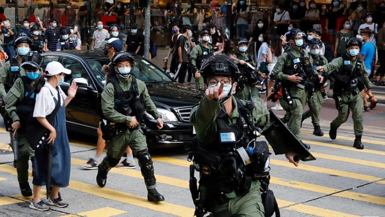 Riot police chase pro-democracy protesters during a demonstration opposing postponed elections, in Hong Kong, China September 6, 2020.