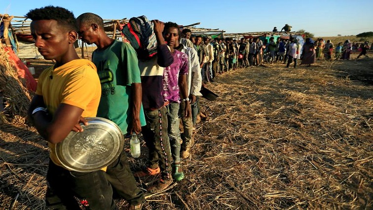 People wait for food assistance in Ethiopia