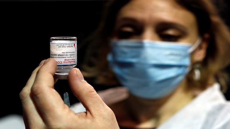 A health worker prepares a syringe with the Moderna coronavirus disease (COVID-19) vaccine at a vaccination center in Le Cannet, France,