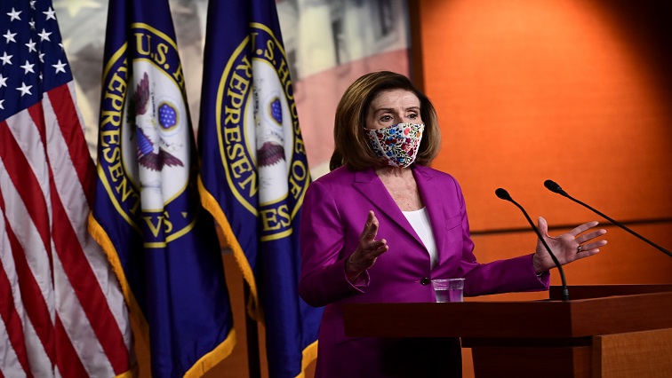 US House Speaker Nancy Pelosi (D-CA) speaks to reporters a day after supporters of US President Donald Trump occupied the Capitol, during a news conference in Washington.