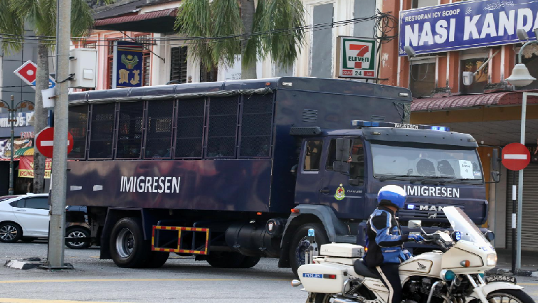 An immigration truck carrying Myanmar migrants to be deported from Malaysia is seen in Lumut, Malaysia.