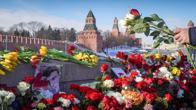 Opposition supporters laid flowers on the bridge in central Moscow where Nemtsov was gunned down on the night of Feb. 27 six years ago.