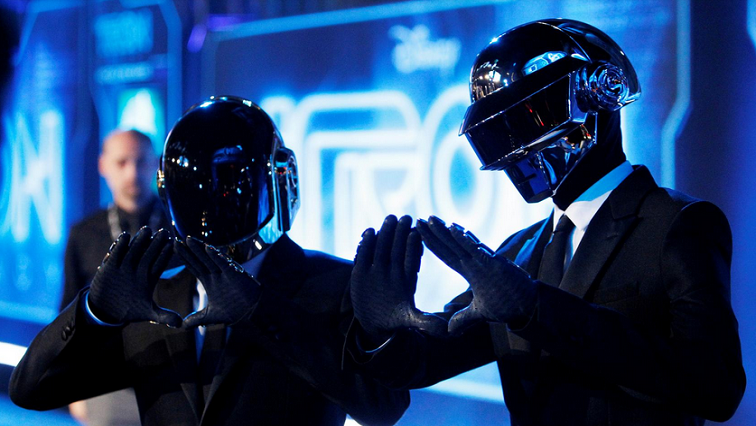 Musicians Thomas Banglater and Guy-Manuel de Homem-Christo of Daft Punk pose at the world premiere of the film "TRON: Legacy" in Hollywood, California.