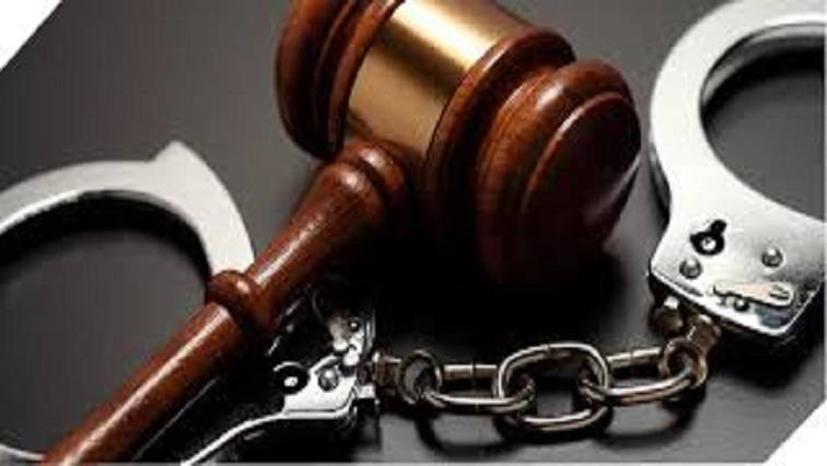 An image of a gavel and handcuffs.
