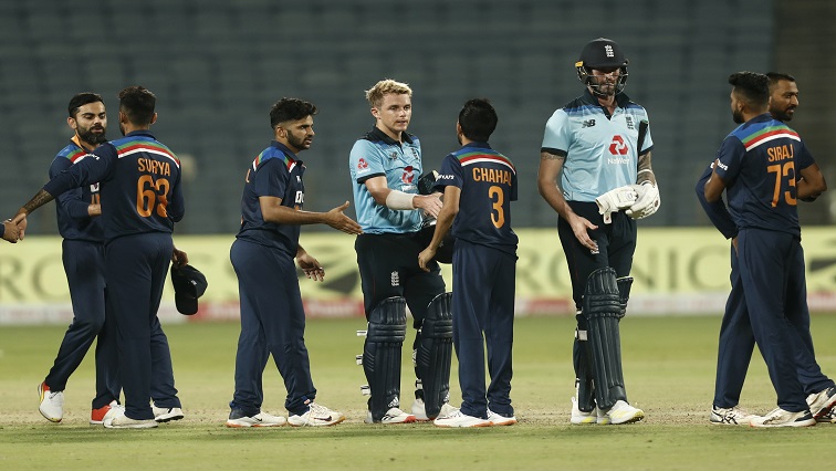 England's Sam Curran shakes hands with India's Yuzvendra Chahal after the match