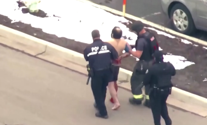 Video footage from the scene broadcast earlier by television stations showed a shirtless, bearded man in boxer shorts being led away from the store in handcuffs