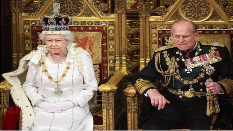 Britain's Queen Elizabeth waits to read the Queen's Speech to lawmakers in the House of Lords, next to Prince Philip, during the State Opening of Parliament in central London, on May 9, 2012.